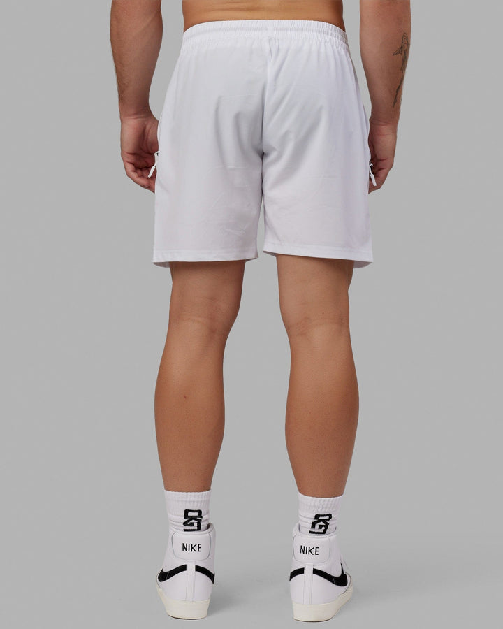 Man wearing Rep 7" Performance Short - White