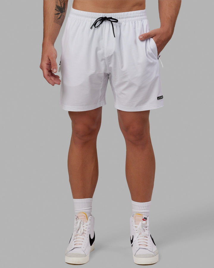 Man wearing Rep 7" Performance Short - White