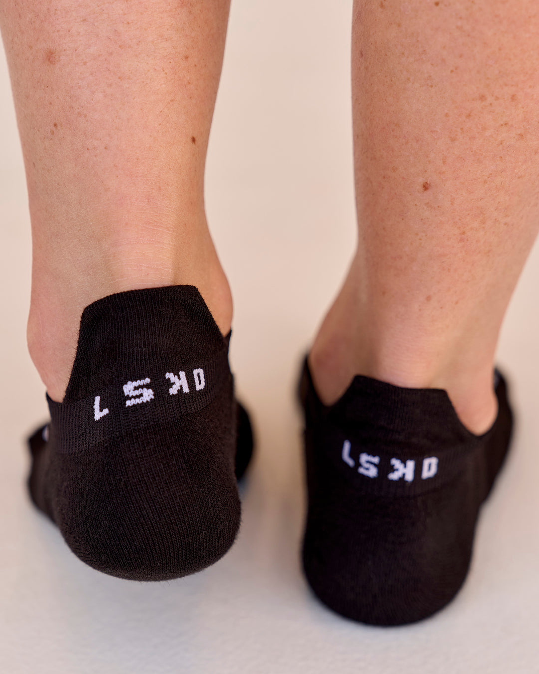 Studio image of Accelerate Performance Ankle Socks - Black-White - view 2