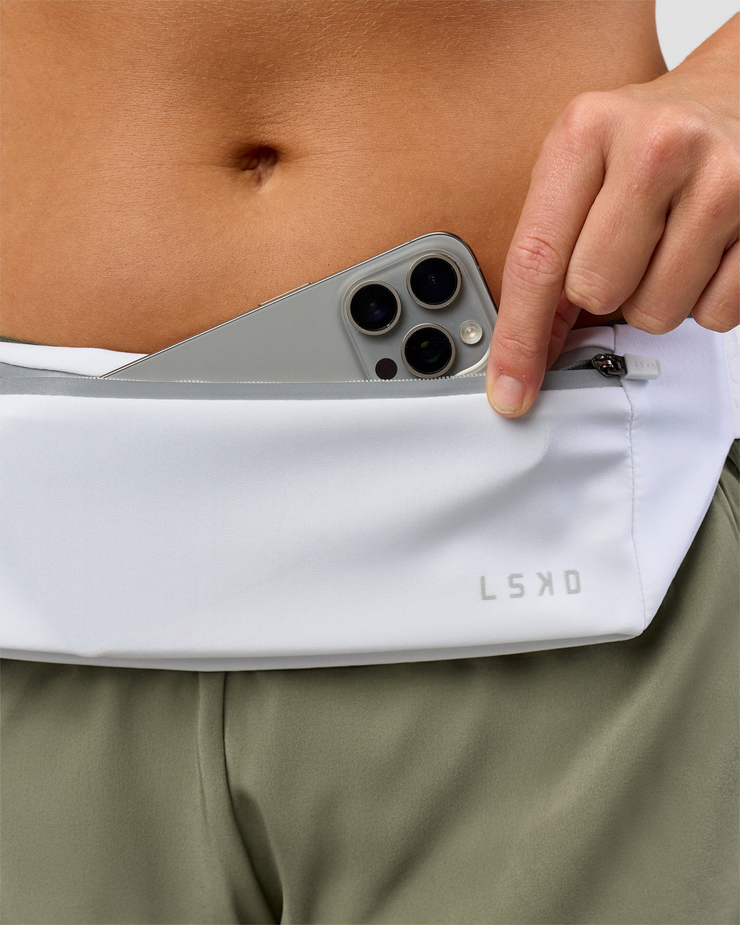 Studio image of Accelerate Run Belt - White-Reflective - view 1
