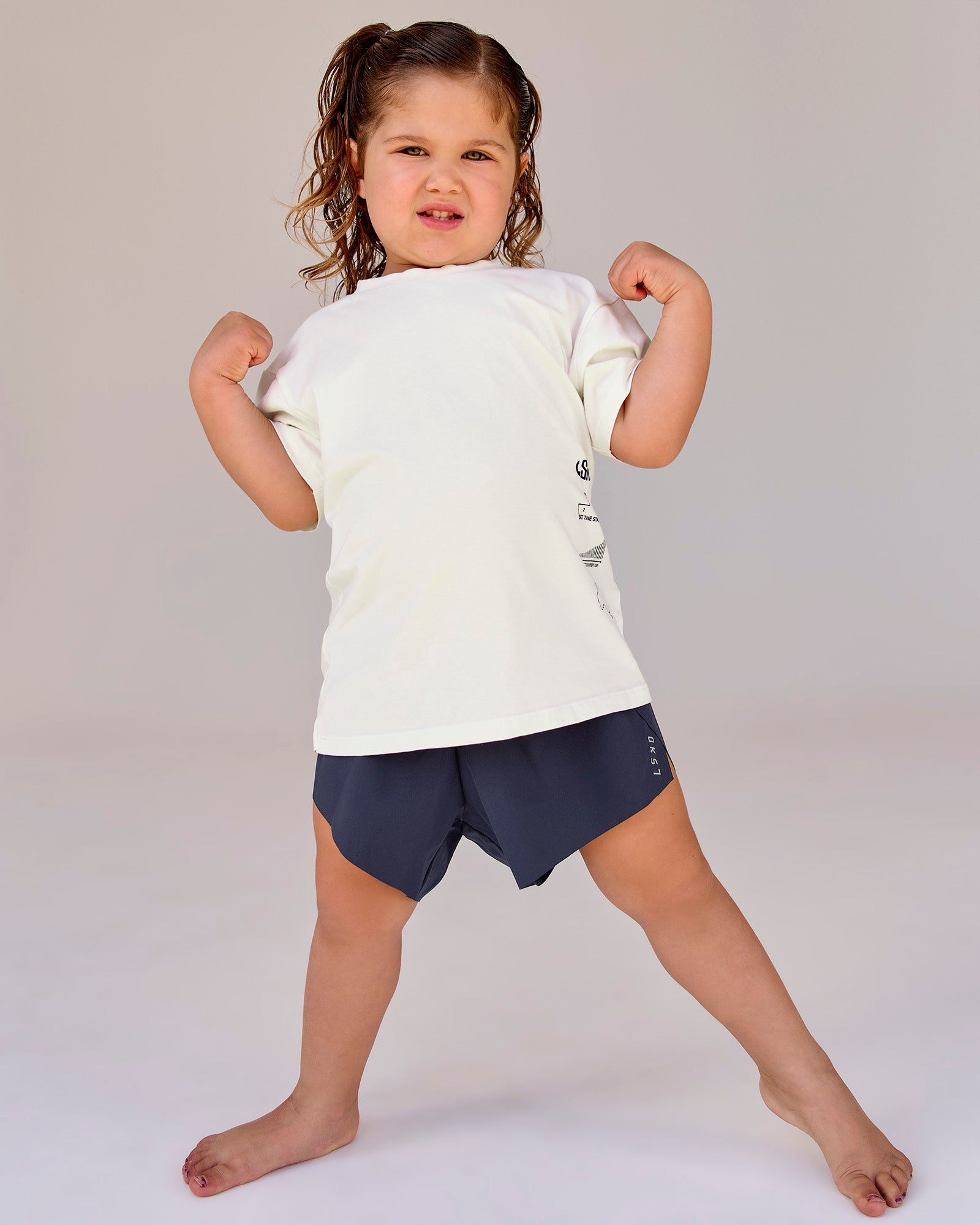 Studio image of Kids Greatest of All Time FLXCotton Tee - Off White Washed-Scarlet