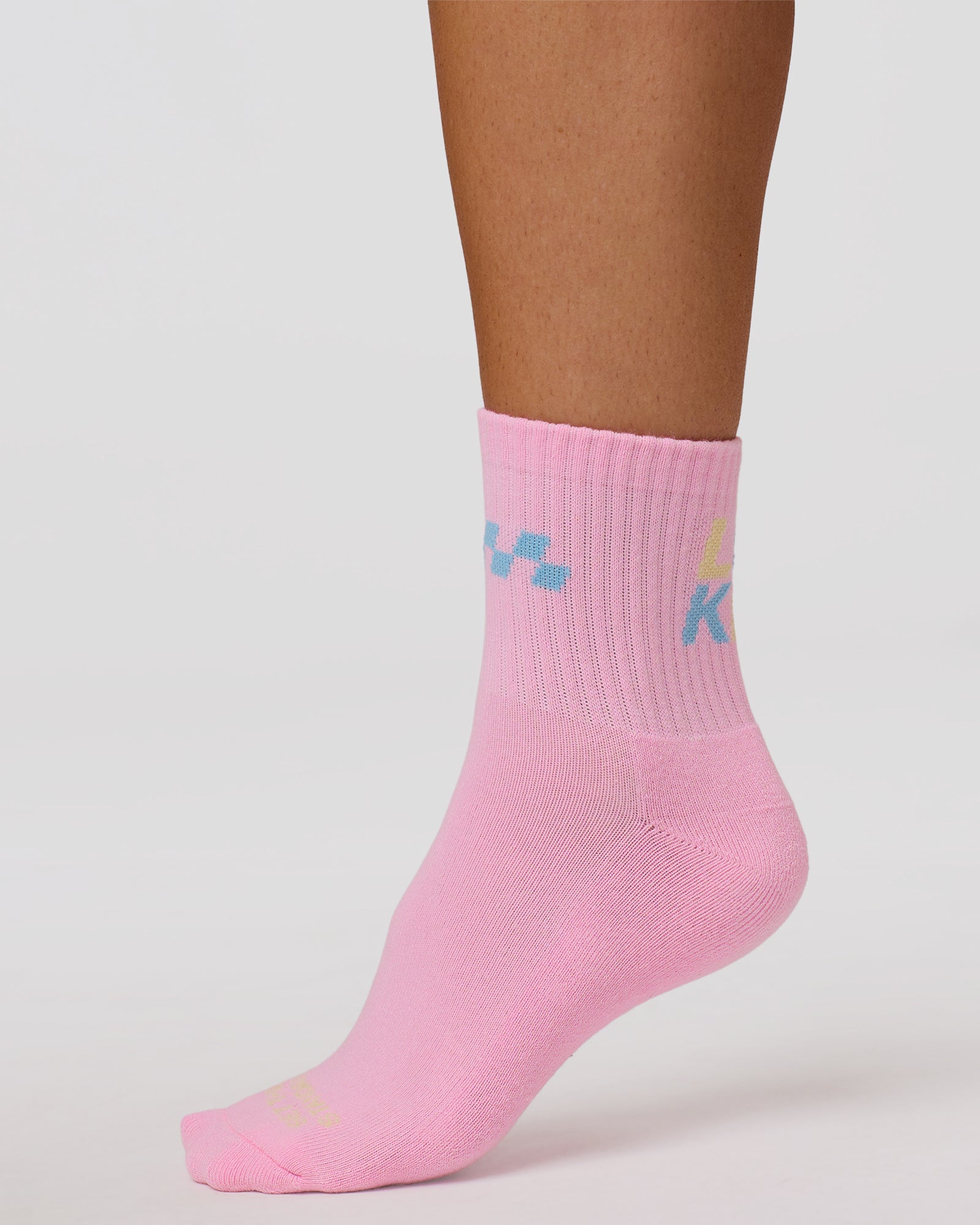 Studio image of Stay in Motion Quarter Socks - Pink Rose-Open Air