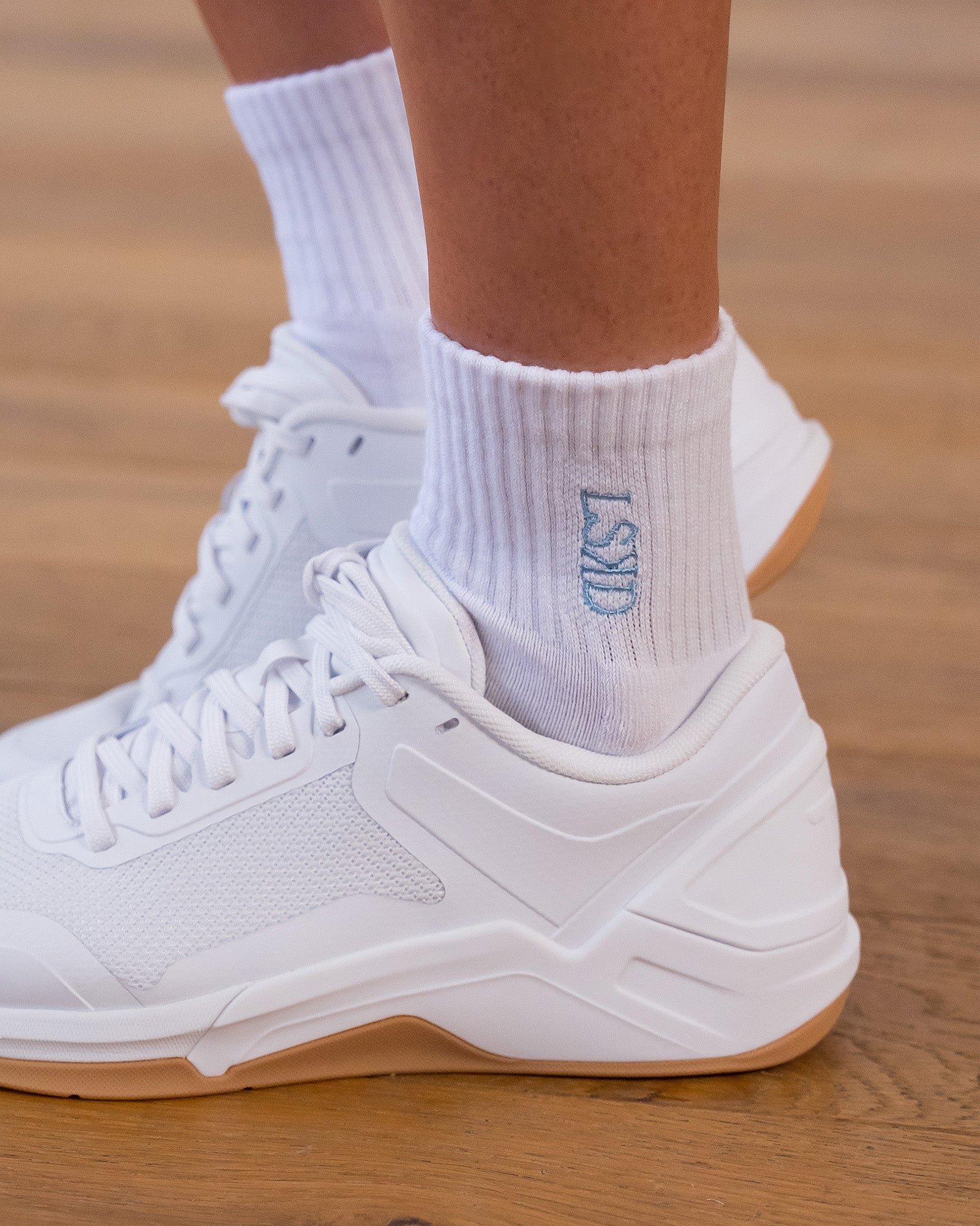 Studio image of Strong is Beautiful Quarter Socks - White-Open Air