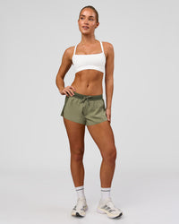 Woman wearing Accelerate 3" Mid-Rise Running Short - Pure Olive-Fog | Model:Xs | Size:ISSY | Thumbnail Index: 11