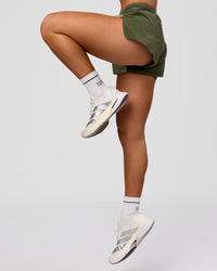 Woman wearing Accelerate 3" Mid-Rise Running Short - Pure Olive-Fog | Model:Xs | Size:ISSY | Thumbnail Index: 13