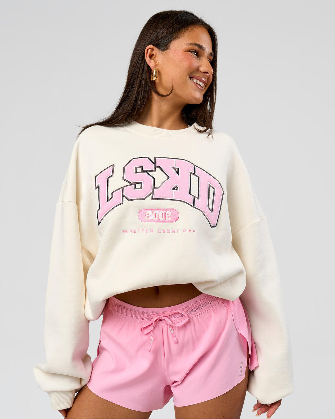 Woman wearing Varsity Boxy Crew - Off White-Pink Rose | Model:Bianca | Size:L