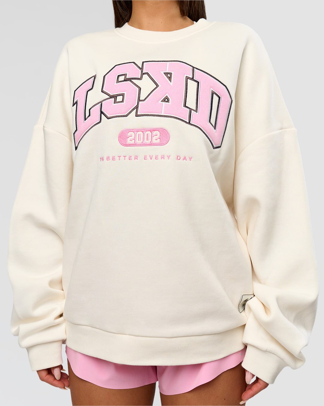 Woman wearing Varsity Boxy Crew - Off White-Pink Rose | Model:Bianca | Size:L