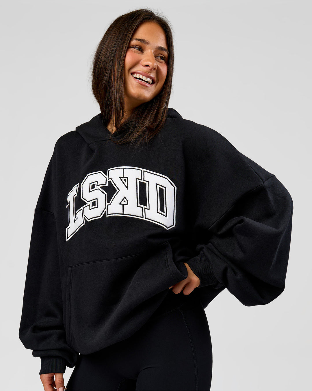 Woman wearing Varsity Boxy Hoodie - Caviar-White | Model:Bianca | Size:L