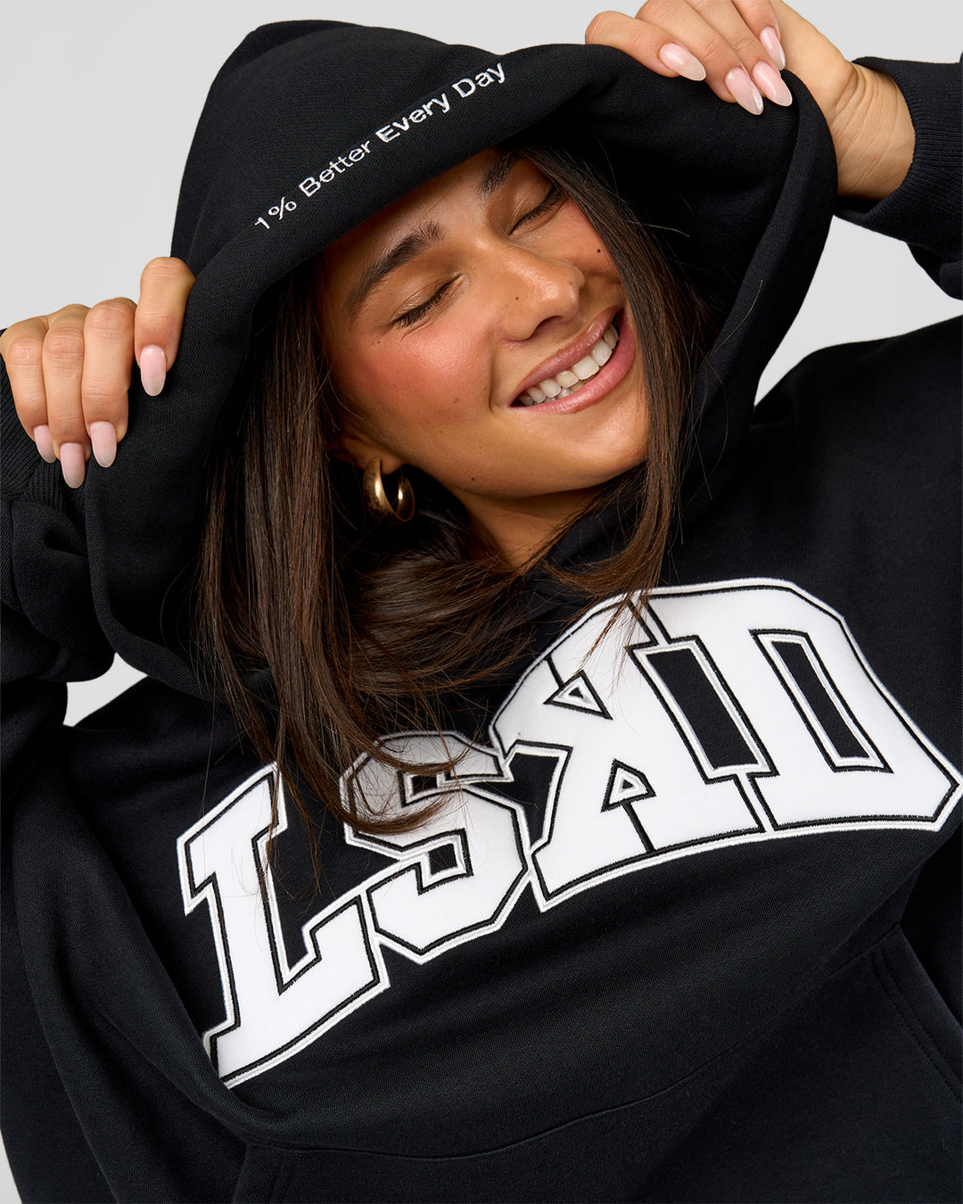 Woman wearing Varsity Boxy Hoodie - Caviar-White | Model:Bianca | Size:L