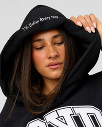 Woman wearing Varsity Boxy Hoodie - Caviar-White | Model:Bianca | Size:L