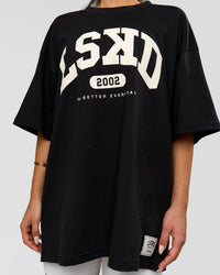 Woman wearing Varsity EST Heavyweight Oversized Tee  - Black-Off White | Model:Bianca | Size:L