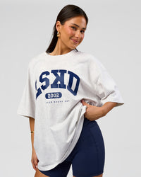 Woman wearing Varsity EST Heavyweight Oversized Tee  - Silver Marl-Future Navy | Model:Bianca | Size:L