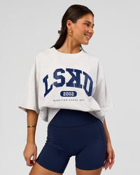 Woman wearing Varsity EST Heavyweight Oversized Tee  - Silver Marl-Future Navy | Model:Bianca | Size:L