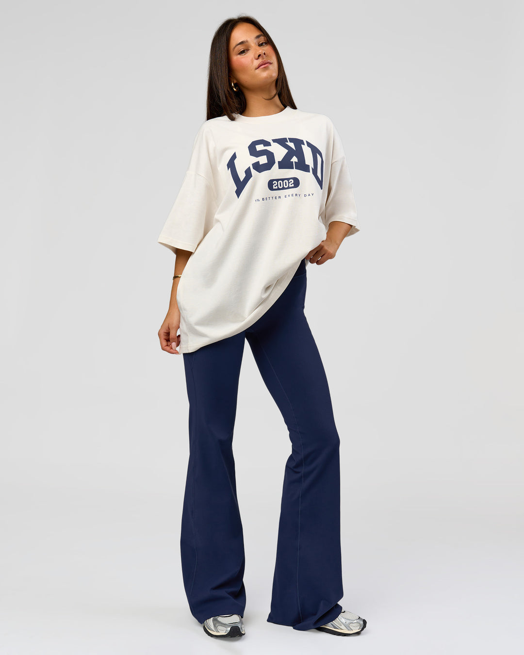 Woman wearing Varsity EST Heavyweight Oversized Tee  - Off White-Future Navy | Model:Bianca | Size:L