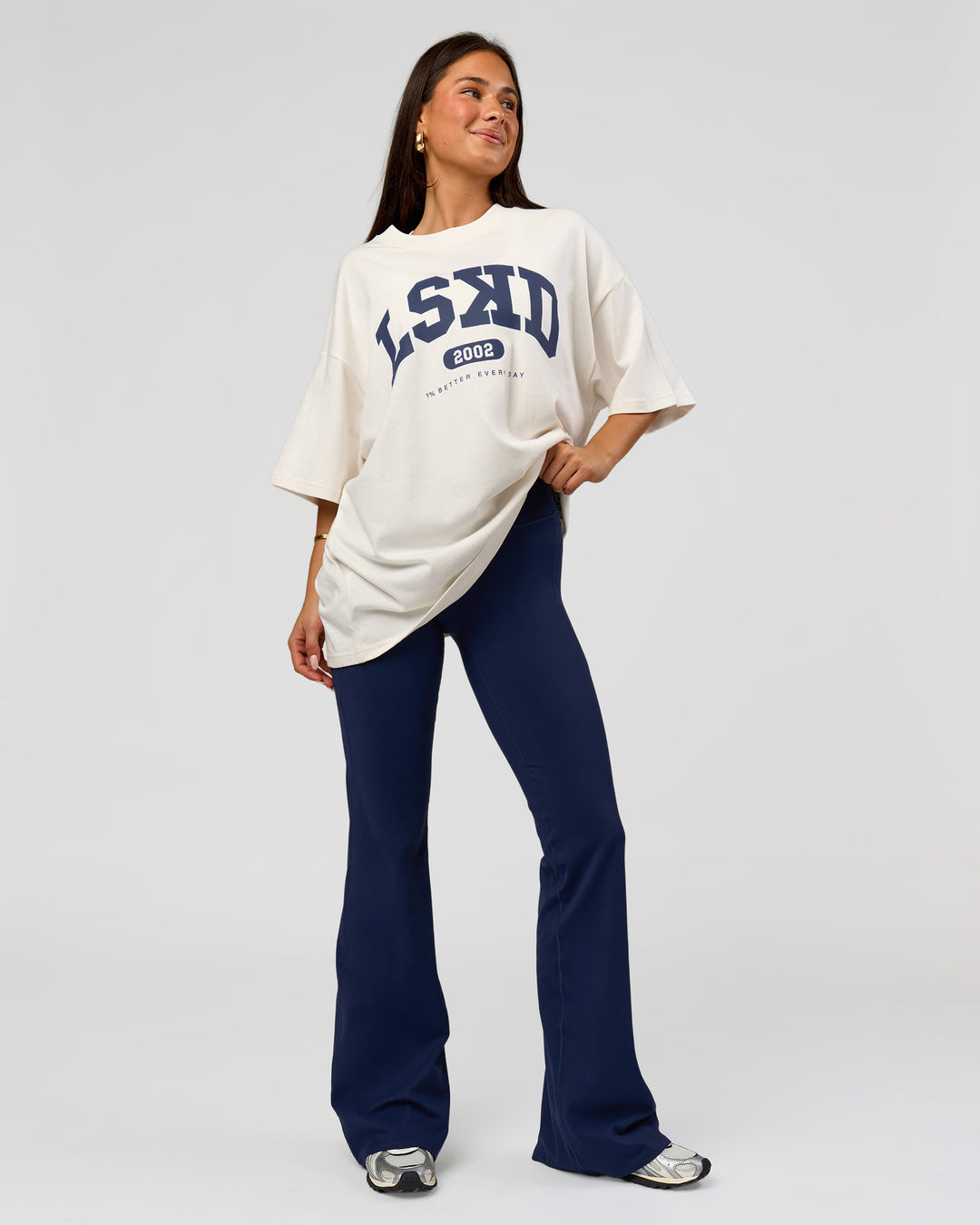 Woman wearing Varsity EST Heavyweight Oversized Tee  - Off White-Future Navy | Model:Bianca | Size:L