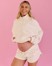 Woman wearing Bree Fleece Track Short - Vanilla Bean | Model:Bree | Size:L | Thumbnail Index: 6