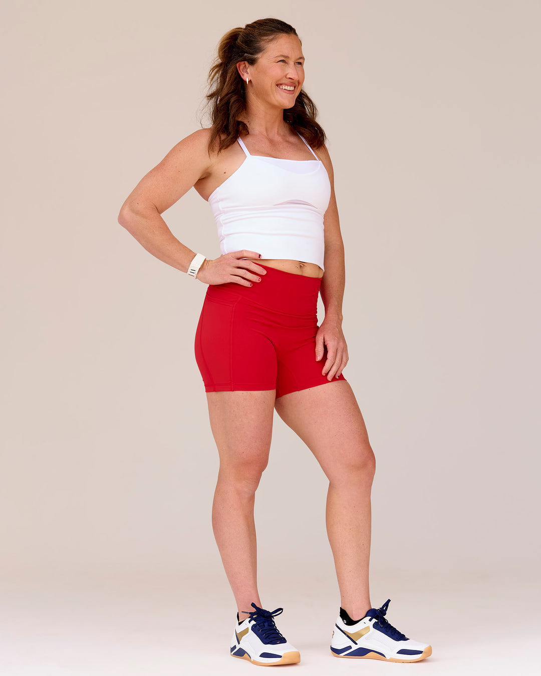 Woman wearing Fusion Ultra High-Rise 6" Short Pockets - Scarlet | Model:Tia | Size:M - view 9