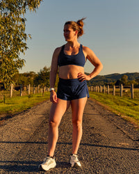 Woman wearing Tia-Clair Toomey-Orr Accelerate 3" Storage Running Short - Future Navy | Model:Tia | Size:M | Thumbnail Index: 15