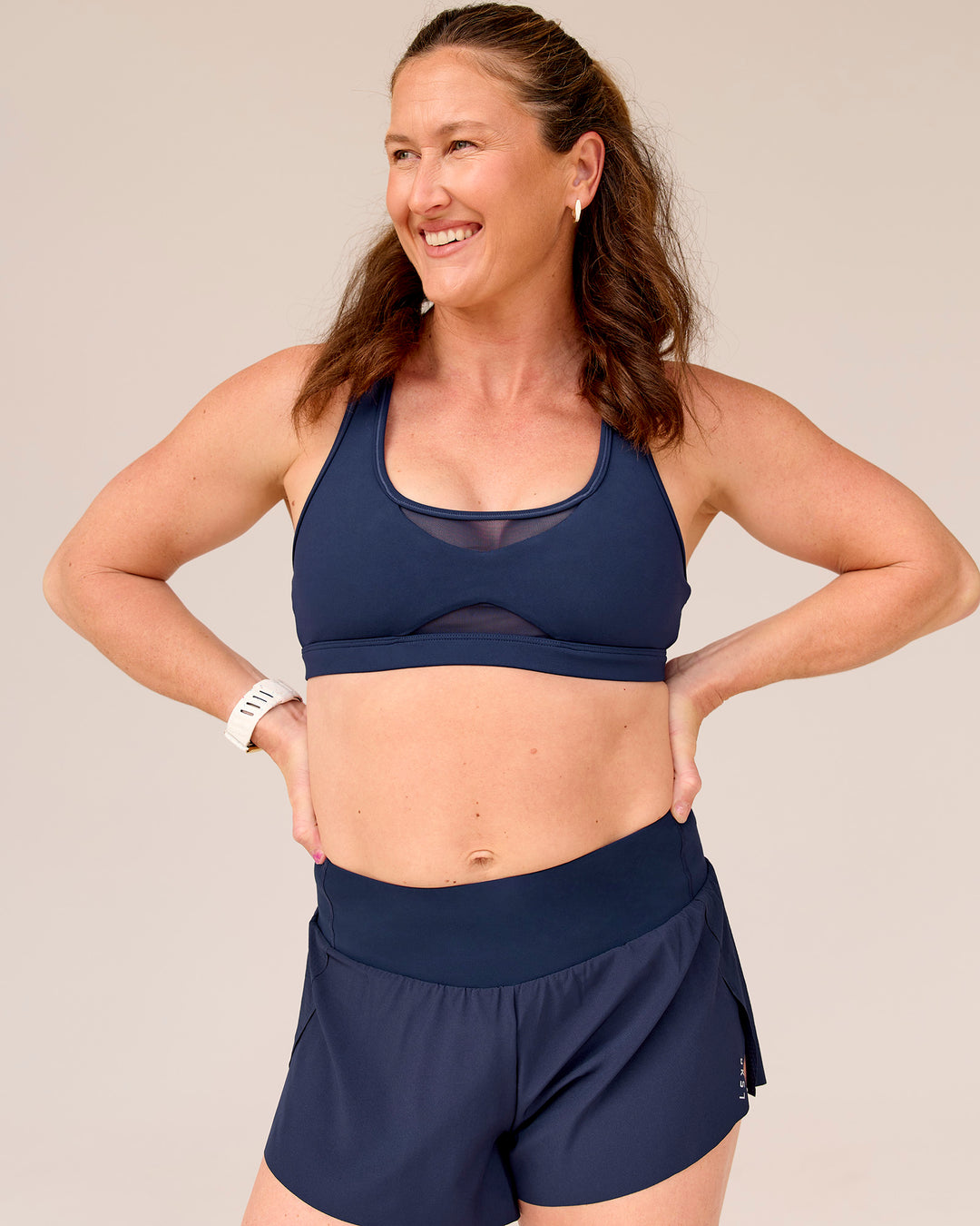 Woman wearing Tia-Clair Toomey-Orr Accelerate 3" Storage Running Short - Future Navy | Model:Tia | Size:M - view 4