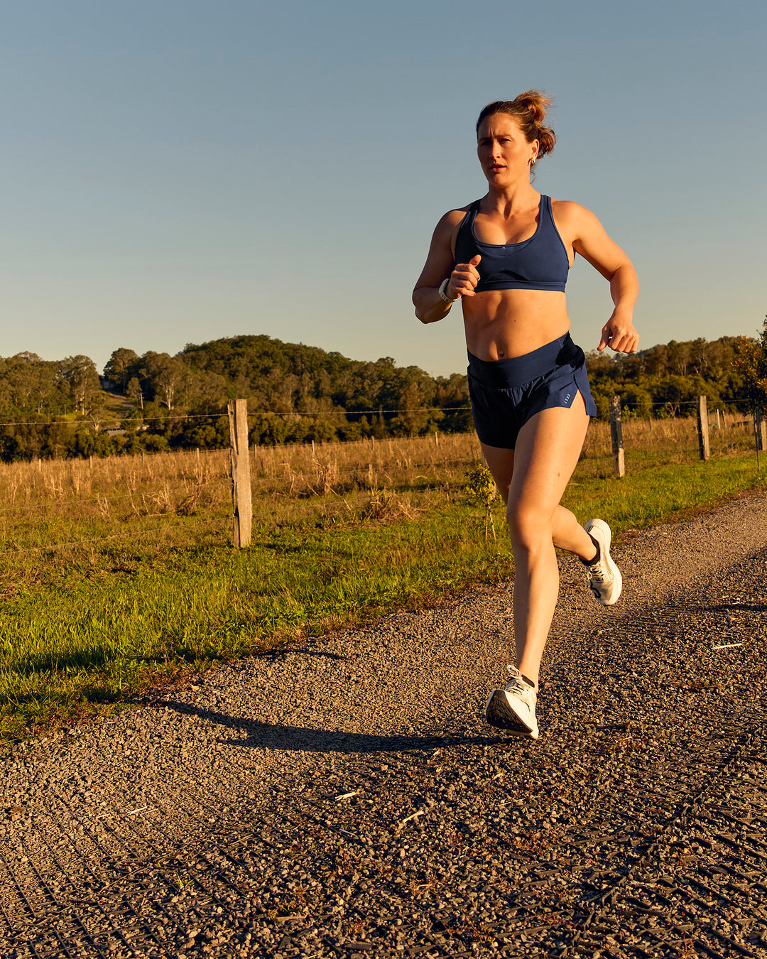 Woman wearing Tia-Clair Toomey-Orr Accelerate 3" Storage Running Short - Future Navy | Model:Tia | Size:M - view 17