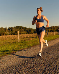 Woman wearing Tia-Clair Toomey-Orr Accelerate 3" Storage Running Short - Future Navy | Model:Tia | Size:M | Thumbnail Index: 16