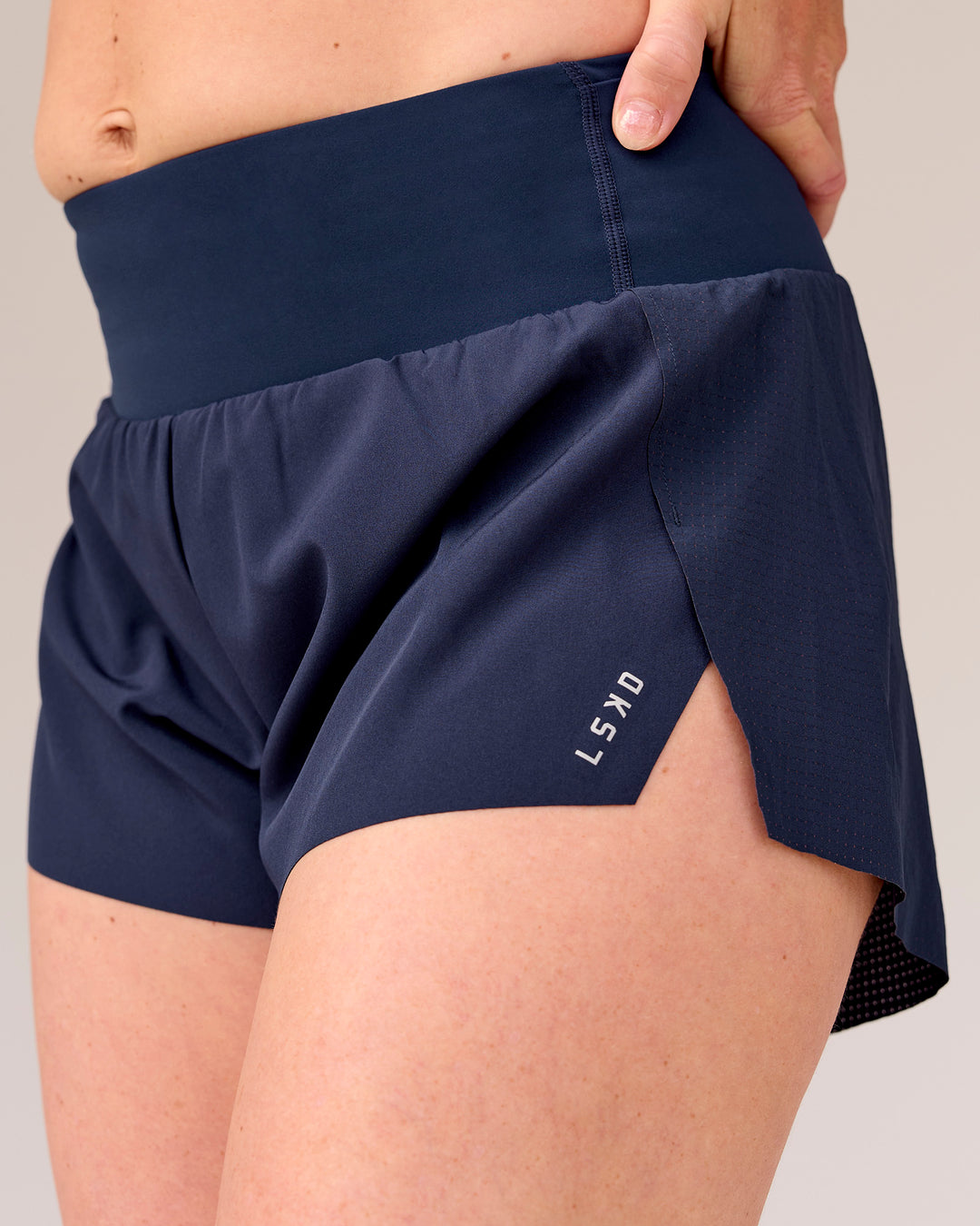 Woman wearing Tia-Clair Toomey-Orr Accelerate 3" Storage Running Short - Future Navy | Model:Tia | Size:M - view 6