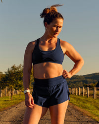 Woman wearing Tia-Clair Toomey-Orr Accelerate 3" Storage Running Short - Future Navy | Model:Tia | Size:M | Thumbnail Index: 0