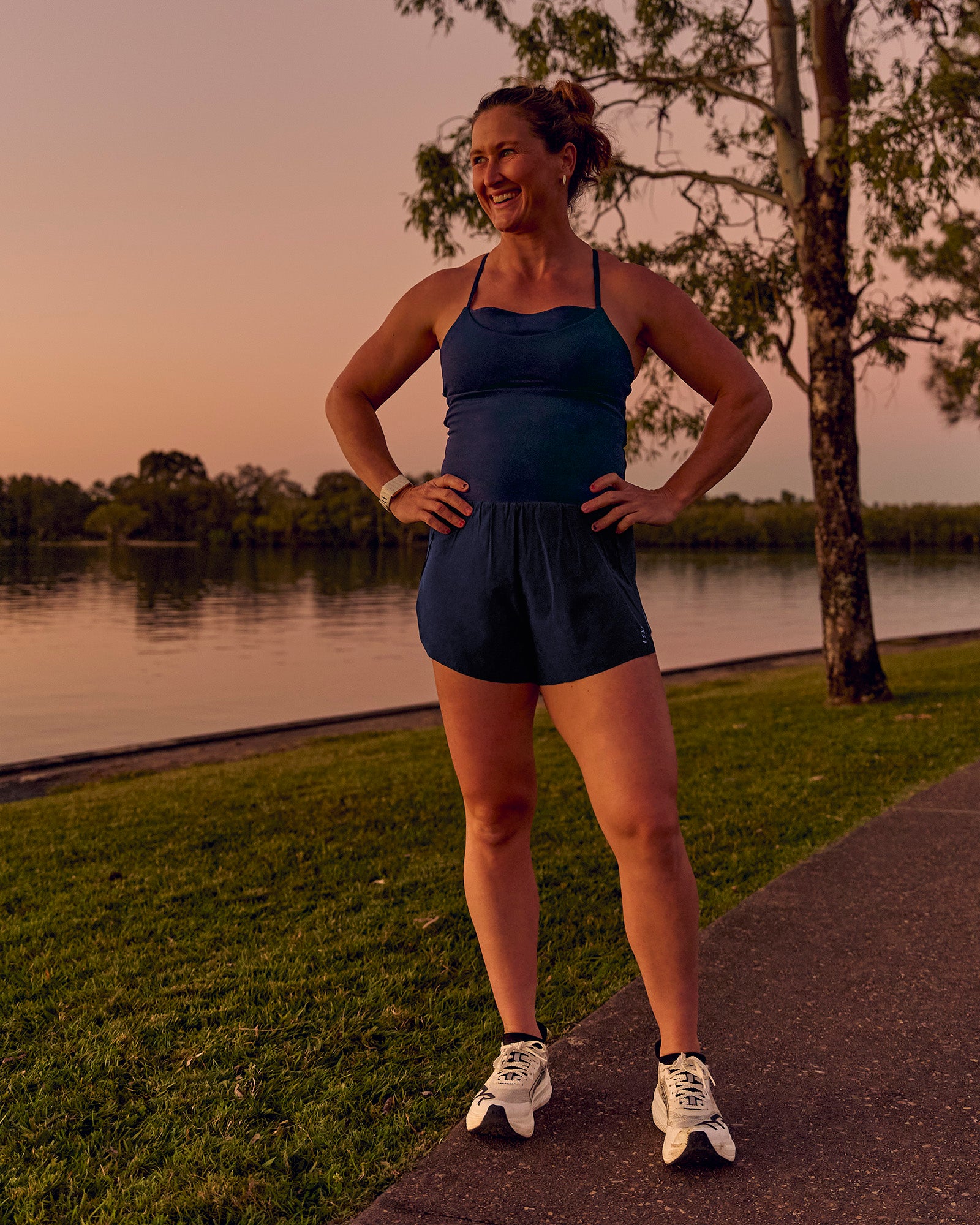 Woman wearing Tia-Clair Toomey-Orr Legacy 3" Run One-Piece - Future Navy | Model:Tia | Size:M