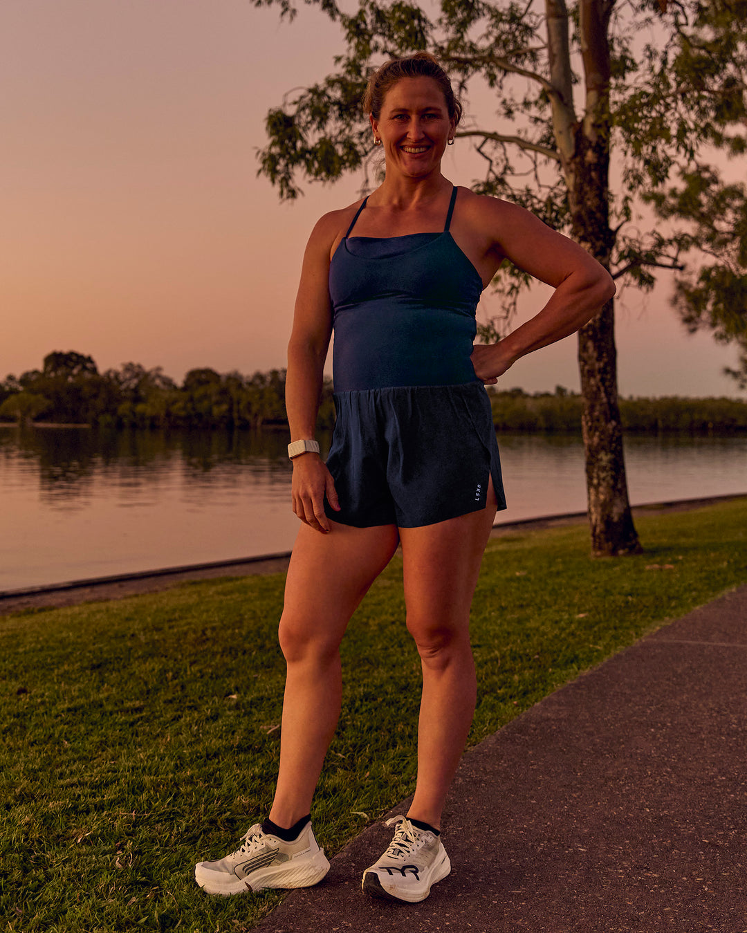 Woman wearing Tia-Clair Toomey-Orr Legacy 3" Run One-Piece - Future Navy | Model:Tia | Size:M - view 24
