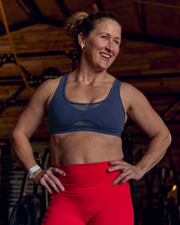 Woman wearing Unstoppable Racerback Sports Bra - Future Navy | Model:Tia | Size:M | Thumbnail Index: 1