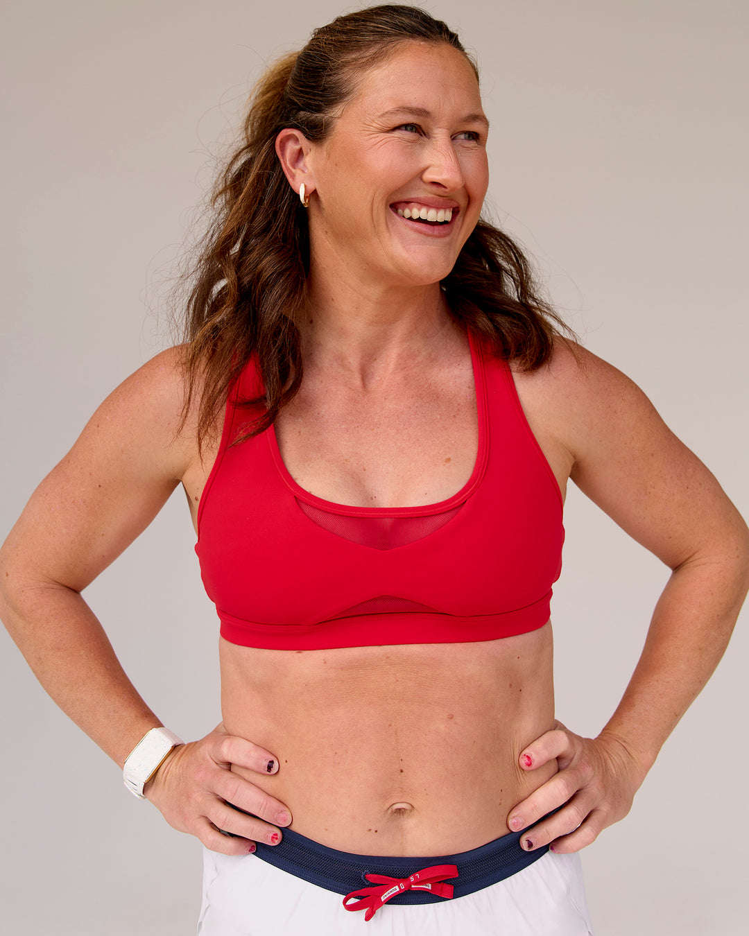 Woman wearing Unstoppable Racerback Sports Bra - Scarlet | Model:Tia | Size:M - view 6