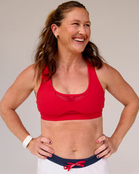 Woman wearing Unstoppable Racerback Sports Bra - Scarlet | Model:Tia | Size:M | Thumbnail Index: 5