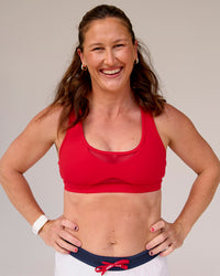 Woman wearing Unstoppable Racerback Sports Bra - Scarlet | Model:Tia | Size:M | Thumbnail Index: 2