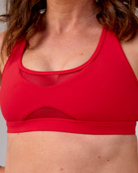 Woman wearing Unstoppable Racerback Sports Bra - Scarlet | Model:Tia | Size:M | Thumbnail Index: 3