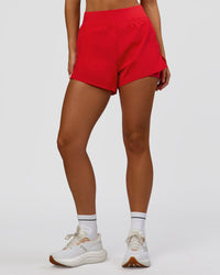 Woman wearing Challenger 3" Lined Performance Short - Scarlet | Model:Amity | Size:S