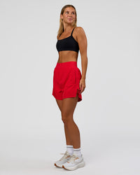 Woman wearing Challenger 5" Lined Performance Short - Scarlet | Model:Amity | Size:S
