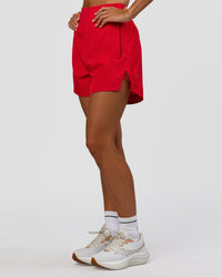 Woman wearing Challenger 5" Lined Performance Short - Scarlet | Model:Amity | Size:S