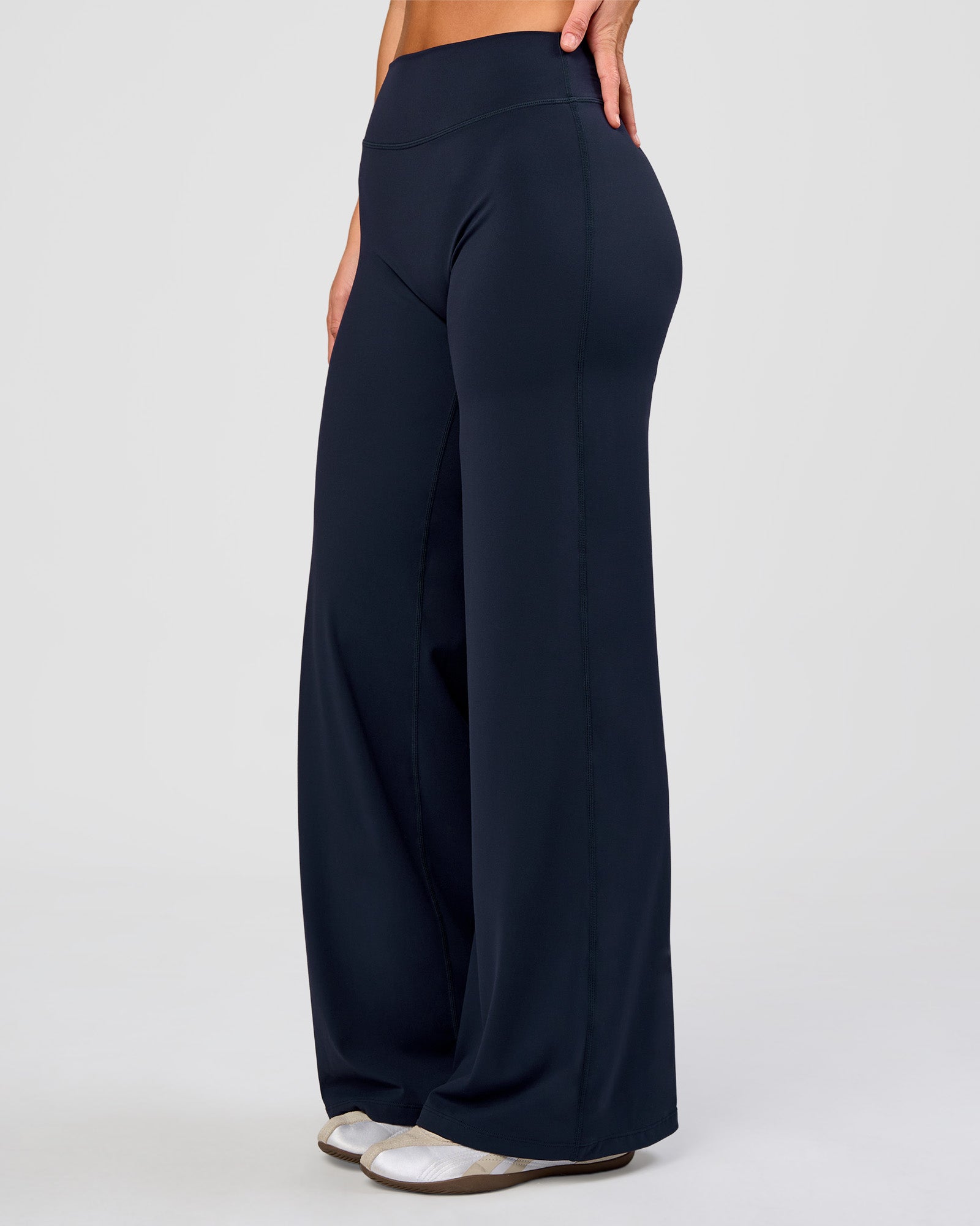 Woman wearing Elixir High-Rise Pant - Midnight Navy | Model:Amity | Size:S
