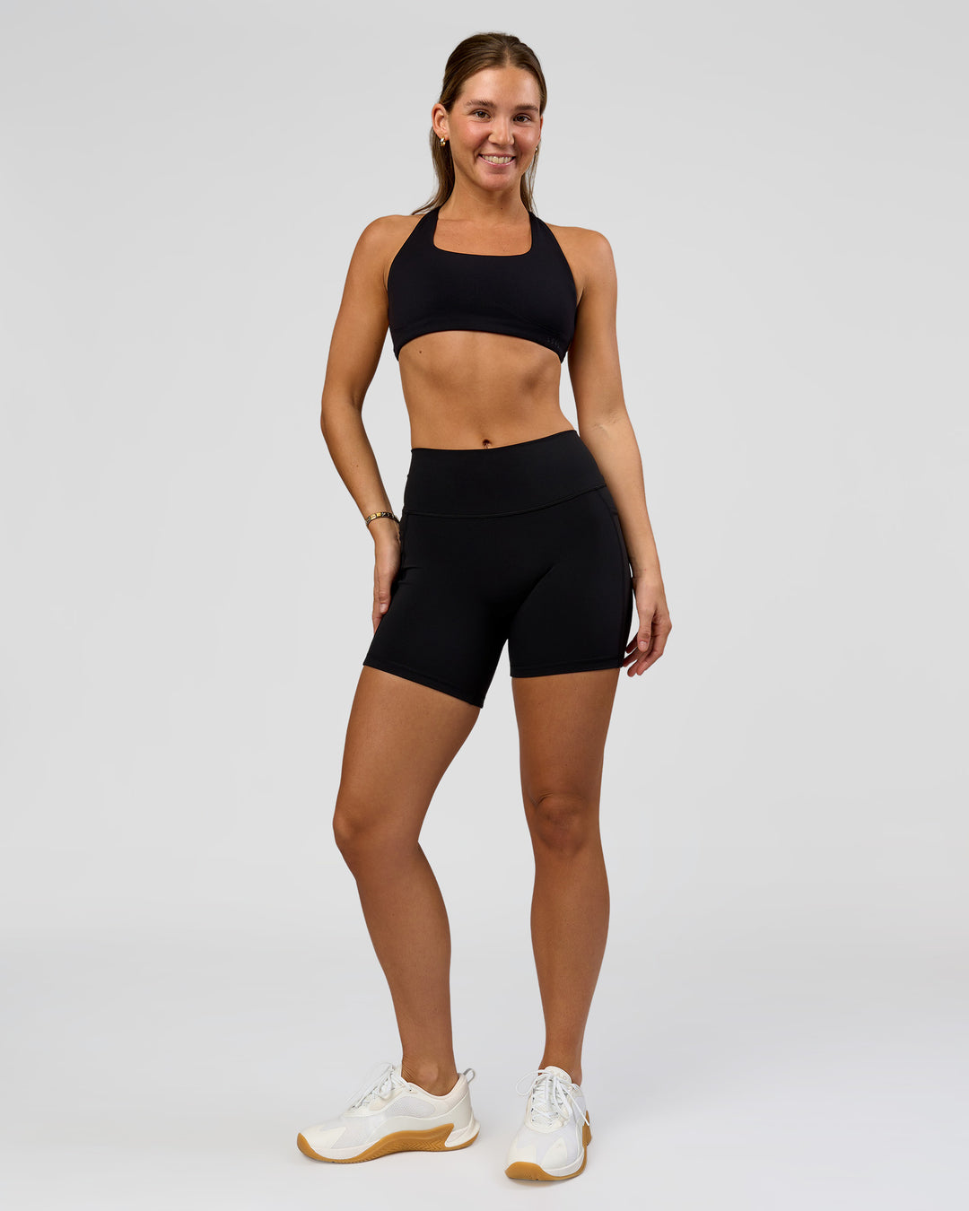 Woman wearing O.G. Fusion High-Rise 6" Short Pockets - Black | Model:Amity | Size:S - view 2
