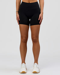 Woman wearing O.G. Fusion High-Rise 6" Short Pockets - Black | Model:Amity | Size:S | Thumbnail Index: 2