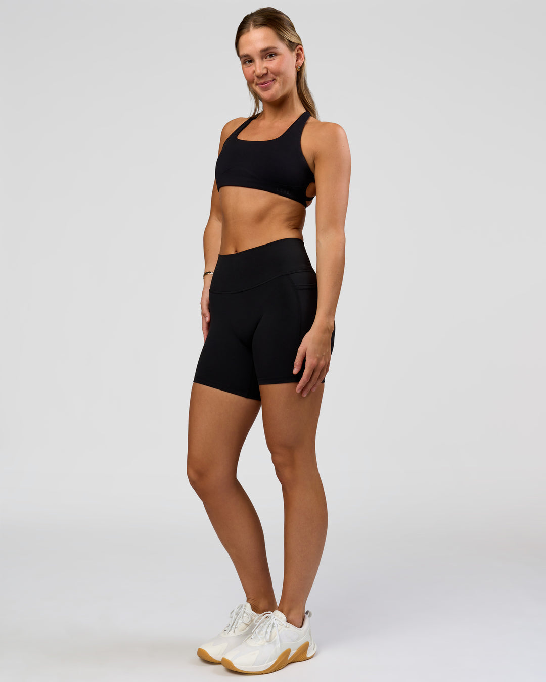 Woman wearing O.G. Fusion High-Rise 6" Short Pockets - Black | Model:Amity | Size:S - view 6