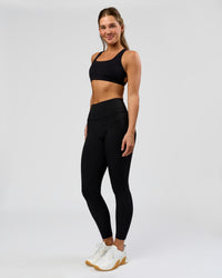 Woman wearing O.G. Fusion High-Rise Full Length Legging Pockets - Black | Model:Amity | Size:S | Thumbnail Index: 8