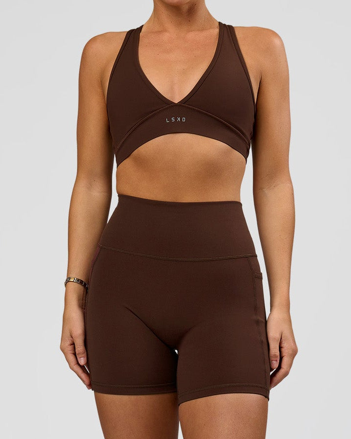 Woman wearing O.G. Fusion Ultra High-Rise 6" Short Pockets - Hot Chocolate | Model:Amity | Size:S - view 1