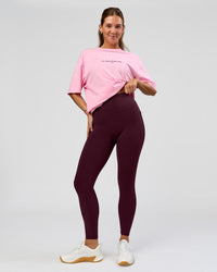 Woman wearing O.G. Fusion Ultra High-Rise Full Length Legging Pockets - Cherry Lacquer | Model:Amity | Size:S | Thumbnail Index: 0
