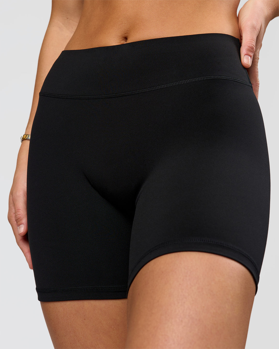 Woman wearing RXD Mid-Rise 6" Short - Black | Model:Amity | Size:S - view 2