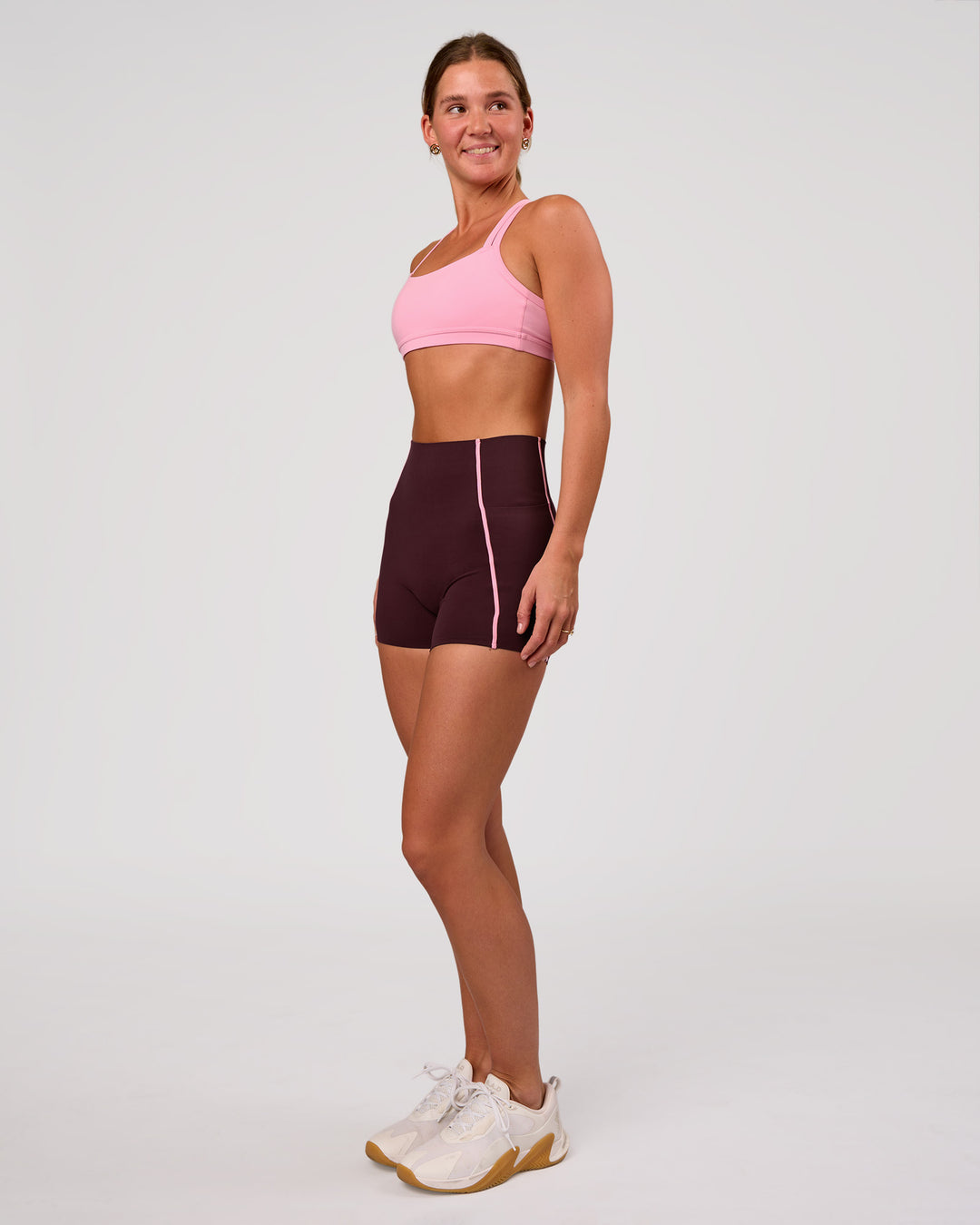 Woman wearing Velocity Sports Bra - Pink Rose | Model:Amity | Size:S - view 4