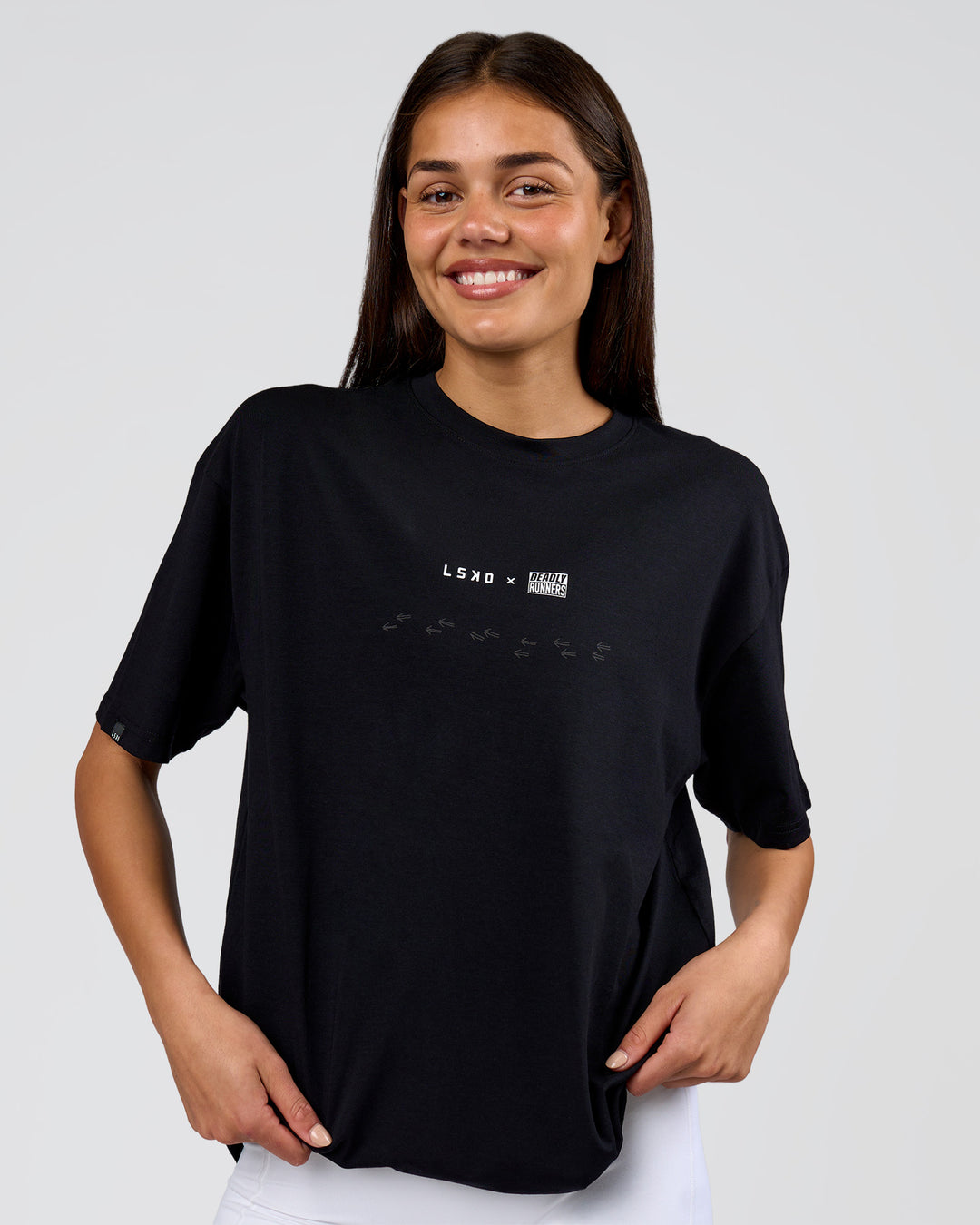 Woman wearing Deadly Runners Run Club FLXCotton Oversize Tee - Black | Model:Bella | Size:S - view 4