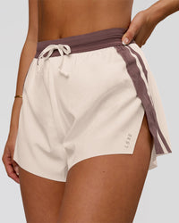 Woman wearing Accelerate 3" Force High-Rise Running Short - Cocoa Powder-Off White | Model:Bianca | Size:S | Thumbnail Index: 0