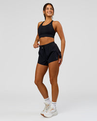 Woman wearing Accelerate 3" High-Rise Running Short - Black | Model:Bianca | Size:S