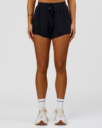 Woman wearing Accelerate 3" High-Rise Running Short - Black | Model:Bianca | Size:S
